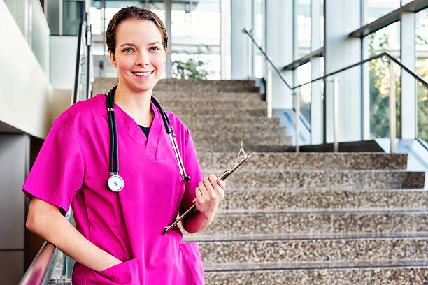 istock Young Friendly Nurse in Pink Scrubs 160195956