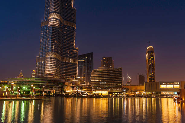 istock Dubai downtown lights shining in blue dusk UAE 160196703