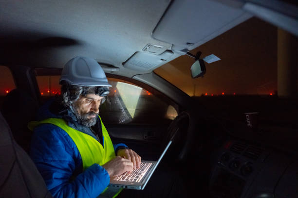 istock Night shift at wind farm. Engineer works late in car. 1601967946