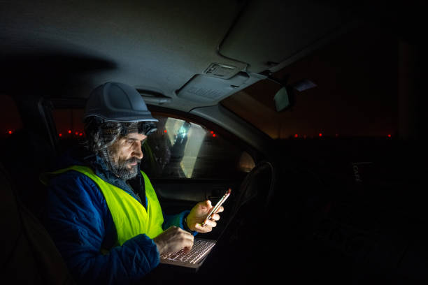 istock Night shift at wind farm. Engineer works late in car. 1601967951