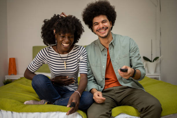 istock Young couple watching TV 1601971855