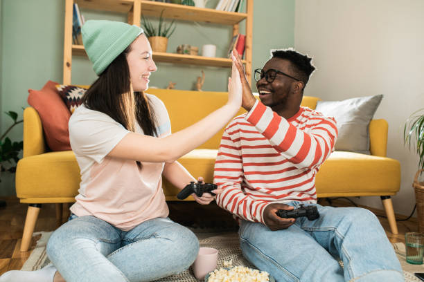 istock Husband and wife gaming and having fun 1601974543