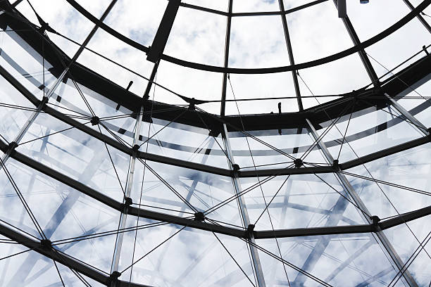 Low angle view of glass ceiling and wall of corporate business buildings, Sydney Australia, full frame horizontal composition
