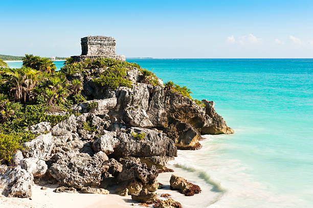 Ruins of Tulum Ruins of the ancient Mayan city of Tulum in Mexico taken on warm summers day with clear blue skies and turquoise caribbean seas. Tulum was one of the last cities inhabited by the Mayas. yucatan photos stock pictures, royalty-free photos & images