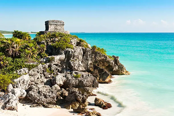 Ruins of the ancient Mayan city of Tulum in Mexico taken on warm summers day with clear blue skies and turquoise caribbean seas. Tulum was one of the last cities inhabited by the Mayas.