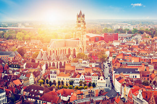 Bruges, Belgium View to the red roofs and beautiful St. Salvator's Cathedral in sunrise st salvator's cathedral stock pictures, royalty-free photos & images