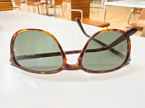 Chic sunglasses on cafe table