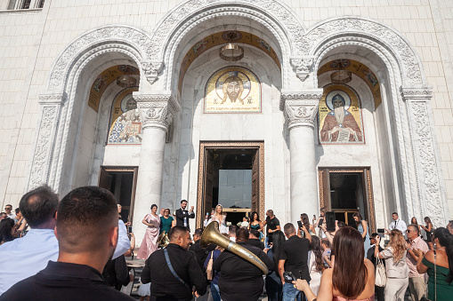 Picture of a Roma band playing their typical instruments (trumpet, trombon, Tuba, etc.) during a wedding in Belgrade, Serbia