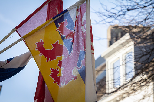 Picture of a flag of limburg waiving in the air in Maastricht, netherlands. Limburg is the southernmost of the twelve provinces of the Netherlands. It is bordered by Gelderland to the north and by North Brabant to its west. Its long eastern boundary forms the international border with the state of North Rhine-Westphalia in Germany.