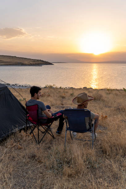istock Father and son camping in nature. 1602165570
