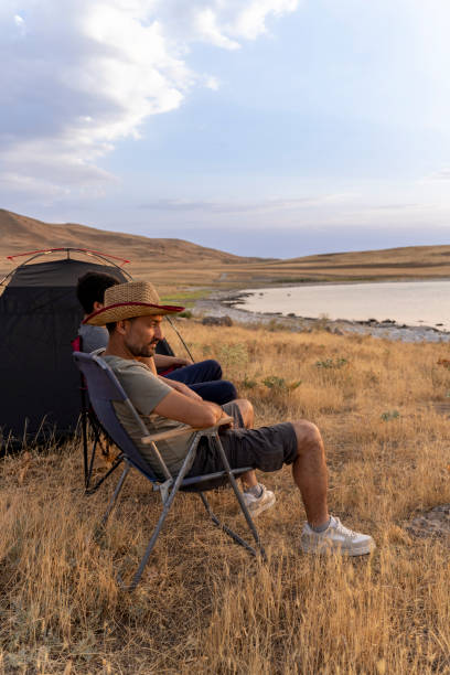 istock Father and son camping in nature. 1602165596