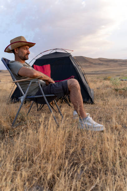istock Father and son camping in nature. 1602165603
