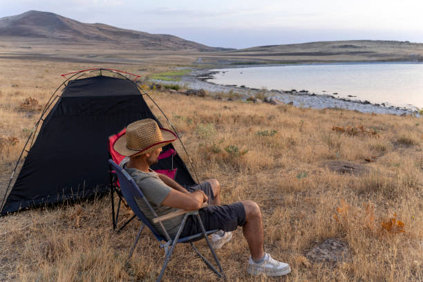istock Father and son camping in nature. 1602165604