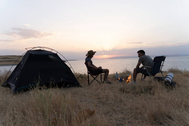 istock Father and son camping in nature. 1602165625