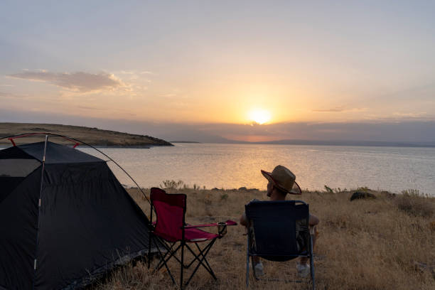 istock Father and son camping in nature. 1602165628