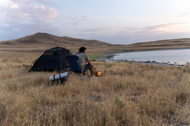 istock Father and son camping in nature. 1602165712