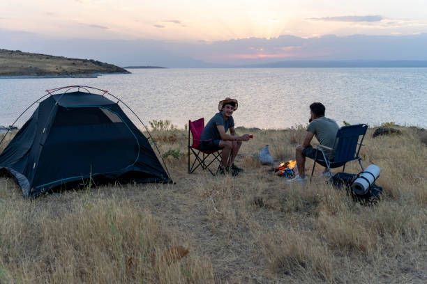 istock Father and son camping in nature. 1602165814