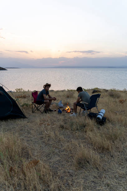 istock Father and son camping in nature. 1602165833