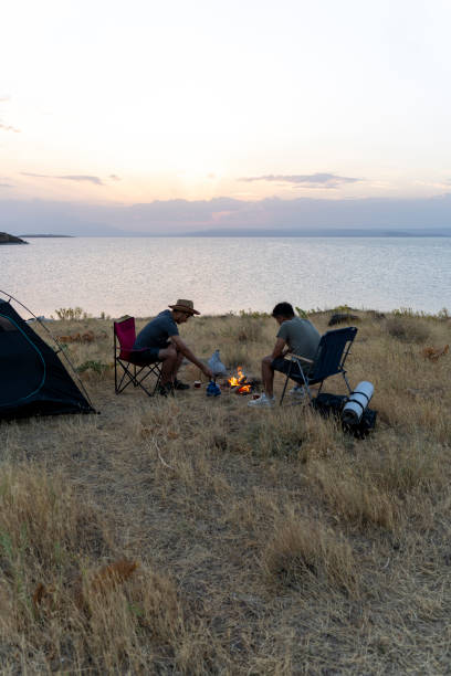 istock Father and son camping in nature. 1602165846