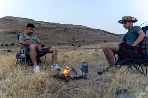 istock Father and son camping in nature. 1602165901