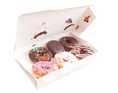 box with donuts in bad condition on white background
