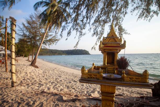 istock Small, golden Buddhist altar standing on a picturesque  beach 1602288990