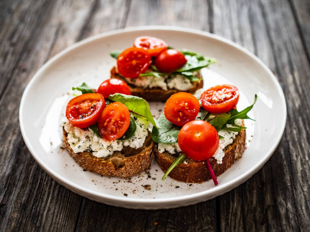 istock Breakfast - cottage cheese, bread and vegetables on wooden table 1602292671