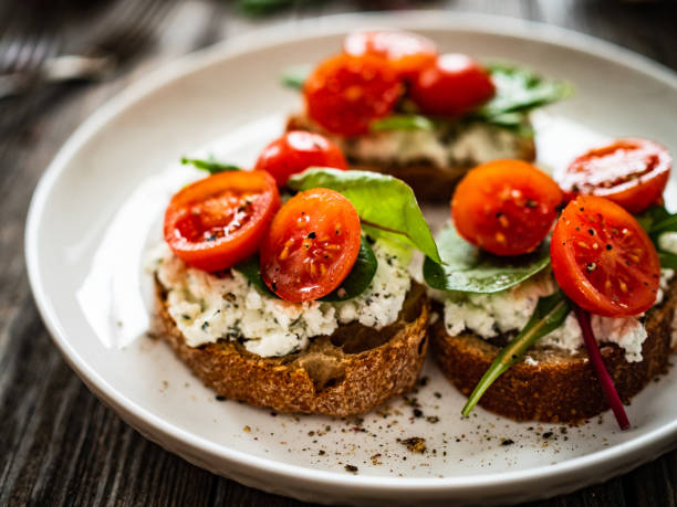 istock Breakfast - cottage cheese, bread and vegetables on wooden table 1602292693
