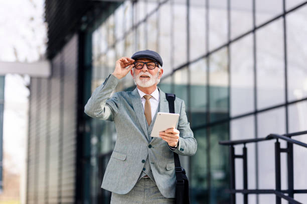 istock Businessman using digital tablet outdoors 1602330003