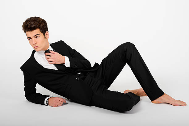 istock Young businessman wearing suit, barefoot, isolated on white 160237085