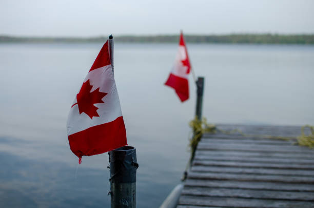 istock candaina flags on a dock in a peaceful lake in Manitoba 1602373114