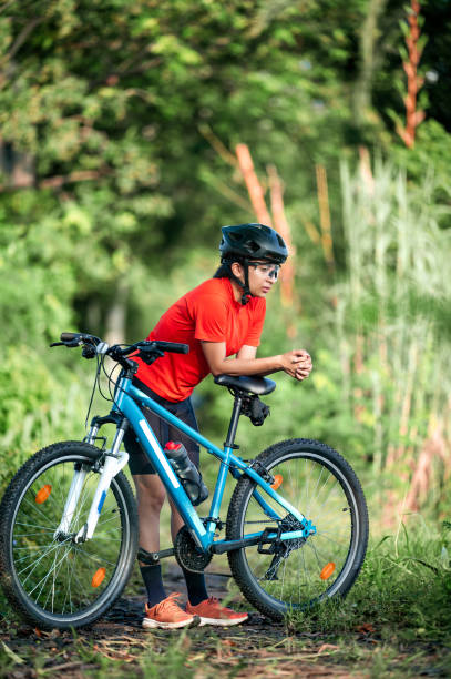 istock Getting ready for off road adventure on sports bicycle in forest 1602380101
