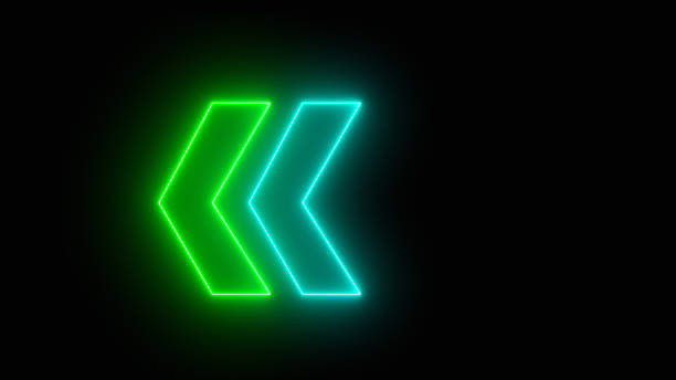 istock neon left direction in the night. Glowing green neon light arrows pointing to the left. Flashing direction indicators. 1602394847