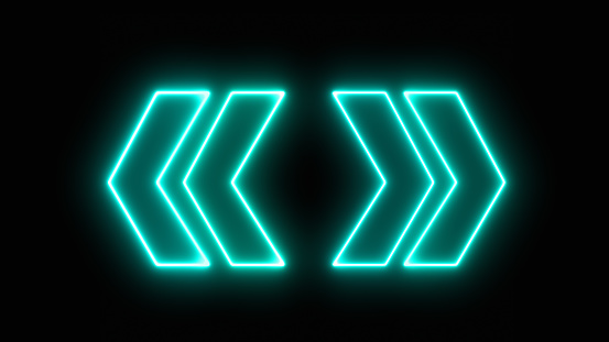 Glowing blue neon arrow sign hanging against black background. Left and right glowing neon direction at night. Lighting sparrow sign.  Flashing direction indicators.