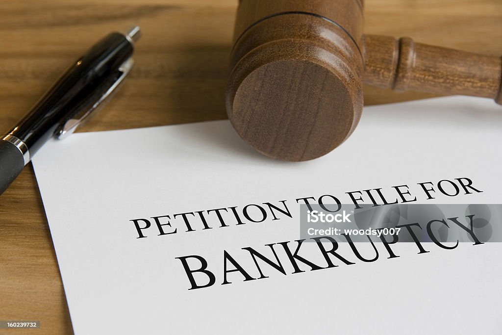 A petition to file for bankruptcy note Bankruptcy concept with judge's wooden gavel and petition notice Courthouse Stock Photo