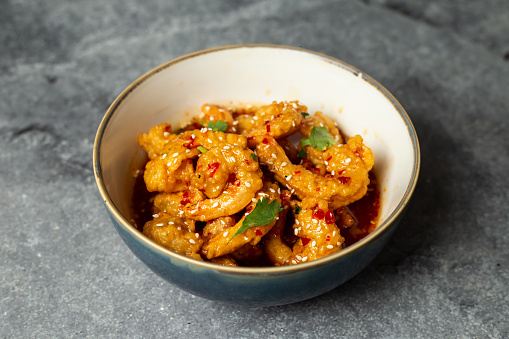Stir fried prawn with vinegar sauce and sesame seeds served in dish isolated on background top view of bangladesh food