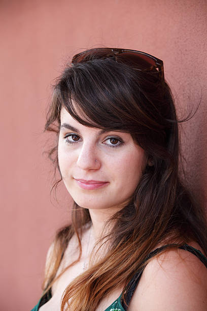istock Young attractive female looking at camera outdoor. 160246727