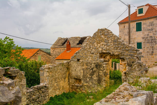 A street of historic derelict stone houses in Loziscz Village in the centre of Brac Island in Croatia