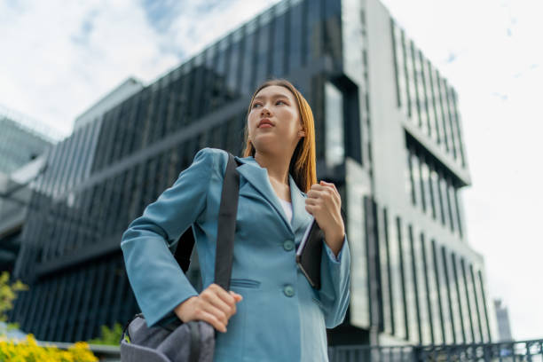 istock Efficiency Unleashed. Young Asian Businesswoman Empowers Business on the Go With A Digital Tablet Against a Contemporary Corporate Buildings in a Central Business District 1602494876