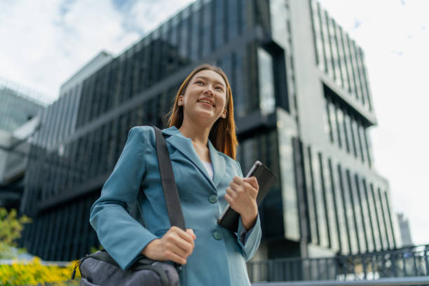istock Efficiency Unleashed. Young Asian Businesswoman Empowers Business on the Go With A Digital Tablet Against a Contemporary Corporate Buildings in a Central Business District 1602495805