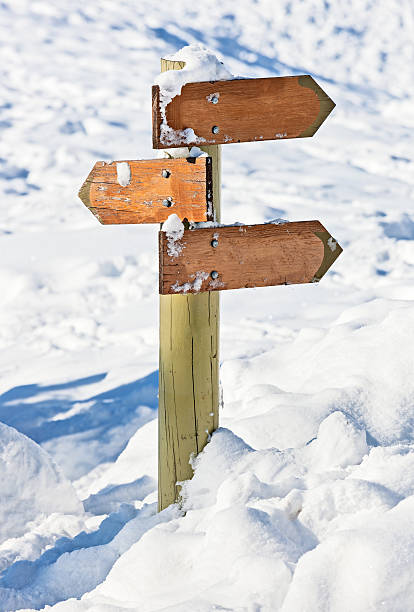 istock Old snow covered wooden signpost (index arrowhead) 160250773
