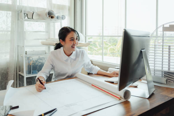 istock Selective focus, Asian female architect or engineer Currently considering materials for designing modern condominiums. Asian female architect or engineer Sit and analyze, design projects in the office 1602535237