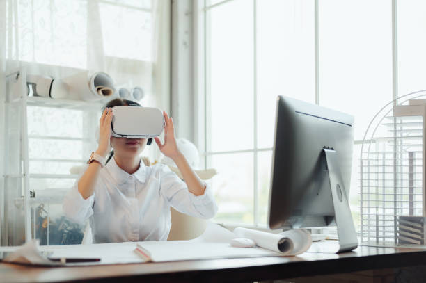 istock Selective focus. Asian female architect or engineer simulating luxury condominium interior design with VR virtual reality technology, using virtual reality technology in engineering design. 1602535243