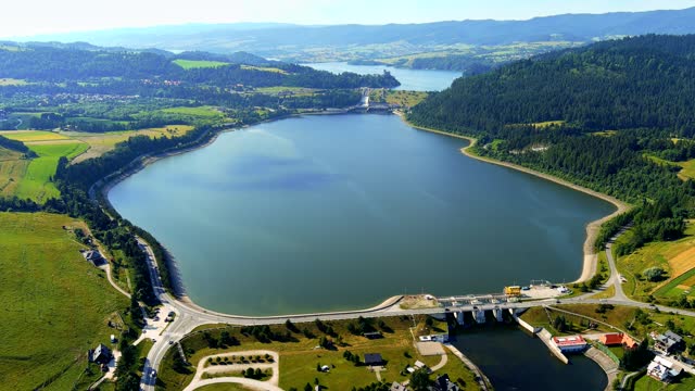Holidays in Poland - Lake Czorsztyn with water dam and Pieniny Mountains in background