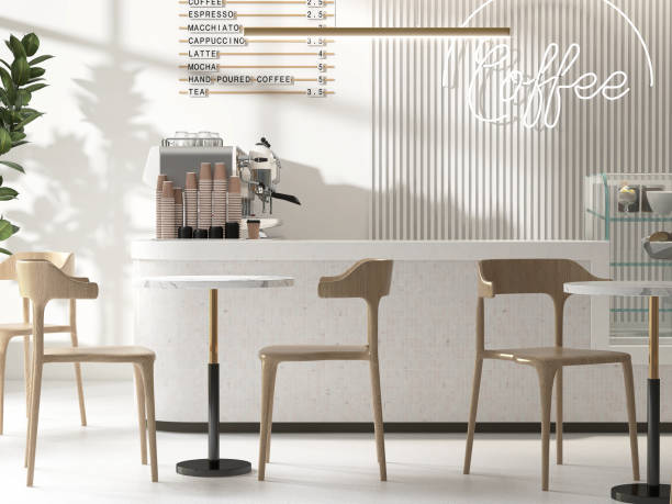 istock White marble cafe countertop, mosaic tile counter, professional espresso maker, tropical tree, table, wooden chair in sunlight, shadow on wall 1602572228