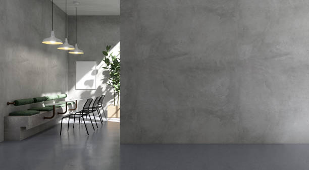 istock Large blank polished cement wall in loft cafe with bench, table, chair, pendant light in sunlight from window on wall and epoxy flooring 1602573805