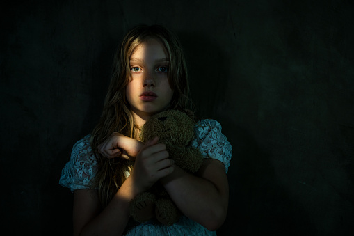 Sad girl in dark room