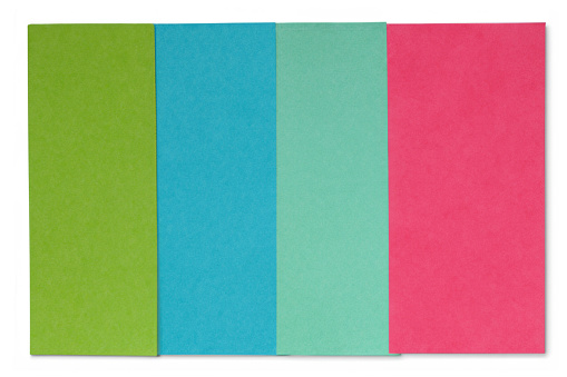 The picture shows colorful sheets of paper for scrapbooking of schoolchildren on a white background.