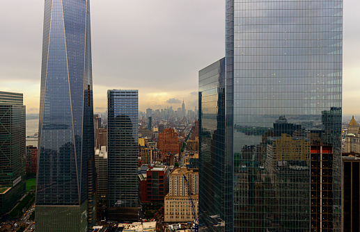 Detailed view of lower Manhattan skyscrapers and one world trade center, New York City, USA. The photo was taken from the roof of a skyscraper on Fulton Street