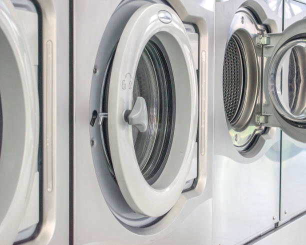 istock Laundromat Washing Machine: Artistic Snapshot and selected focus. 1602672050